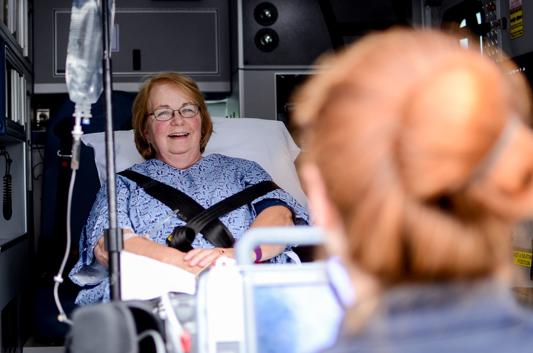NEMHS paramedic caring for a patient during transport